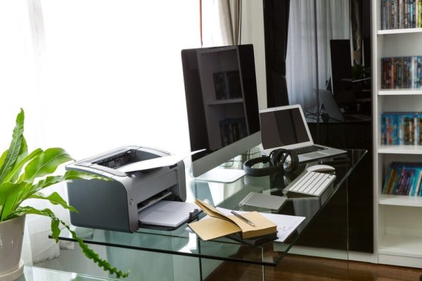 office-with-computer-glass-table_1232-514